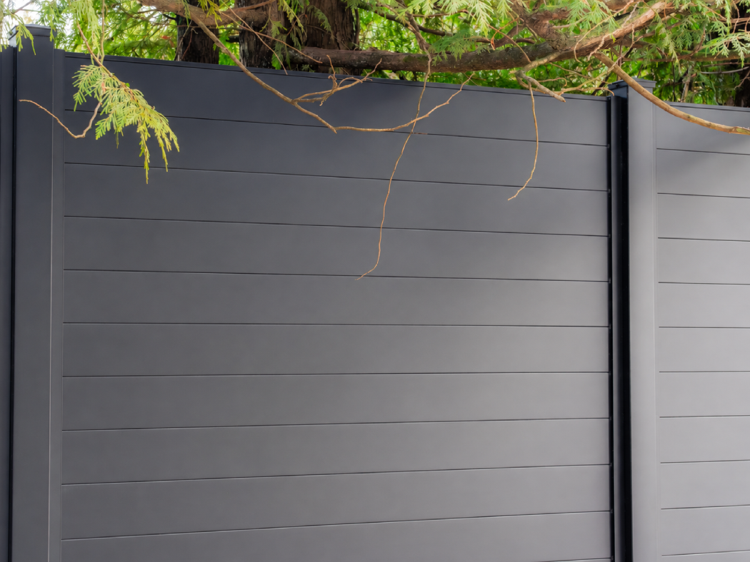 SLEEKFENCE Lineara Full Privacy fence with a smooth aluminum surface and no accessible handholds or footholds