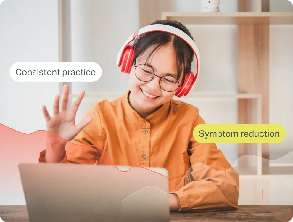 Smiling young woman with glasses and red headphones waving while looking at a laptop, with text bubbles saying 'Consistent practice' and 'Symptom reduction'.