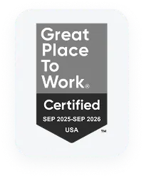 Circular medal with text Best Places to Work in white on gray background.