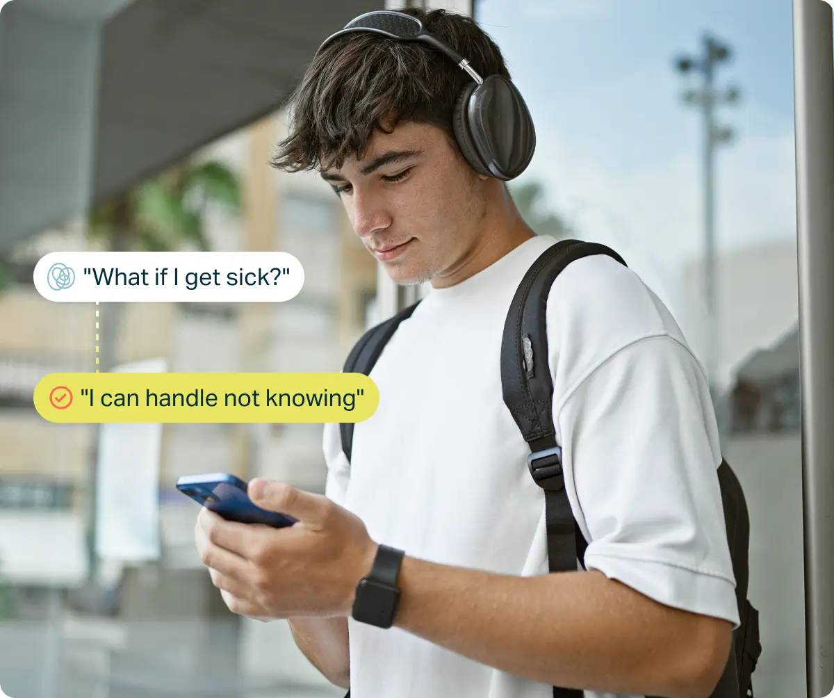 Young man with headphones and backpack looking at phone, with text bubbles showing self-talk: 'I'll fail this test' and 'I've prepared, I can handle it' emphasizing positive mindset.