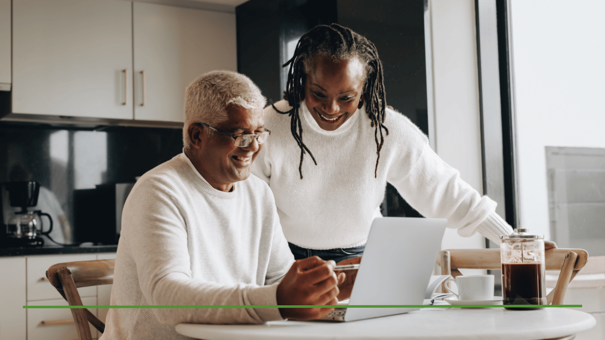 Couple reviewing their financial plan together on a laptop at home