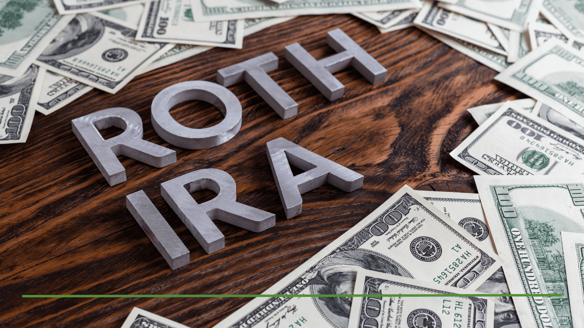 Image with text overlay in a green banner that reads "WHO CANNOT DO A BACKDOOR ROTH IRA?". Below the text are large silver three-dimensional letters spelling "ROTH IRA" on a dark wood grain table. The table is scattered with multiple US $100 bills. In the 