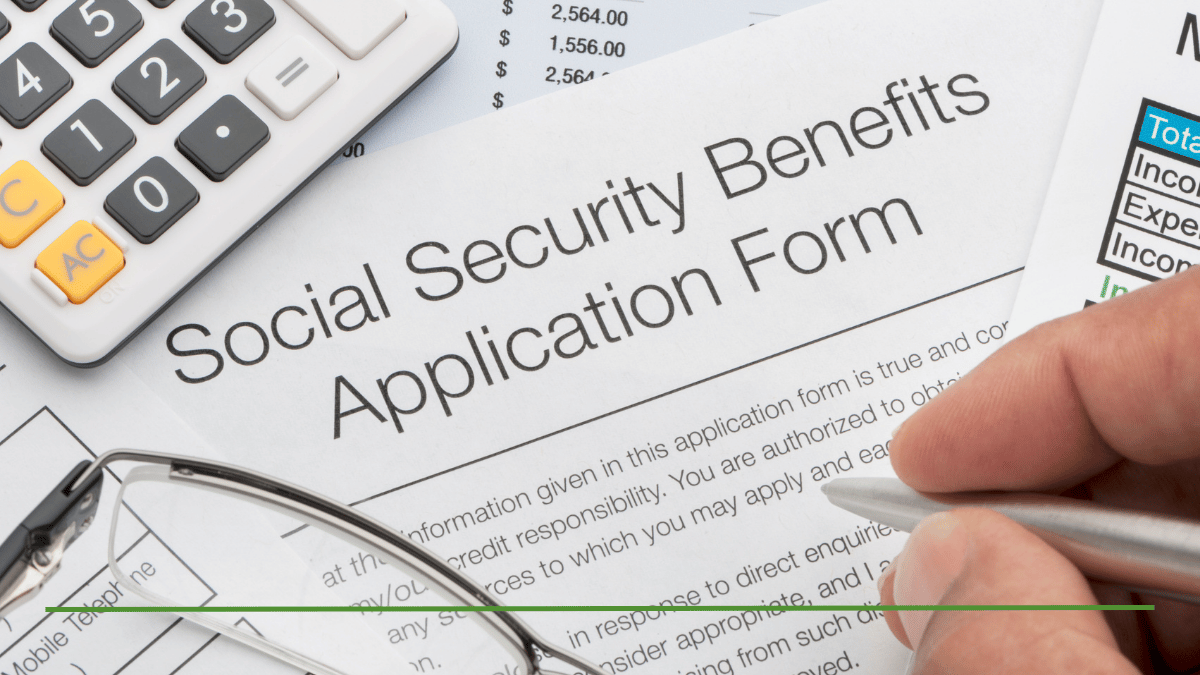 Social Security Benefits Application form with a pen, calculator, and glasses, representing how to calculate the highest possible Social Security payment per month