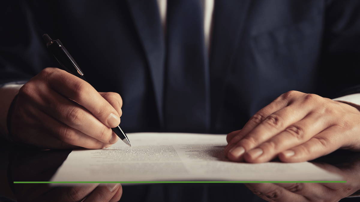 Financial advisor signing retirement tax planning documents, representing Big Beautiful Bill Social Security tax changes