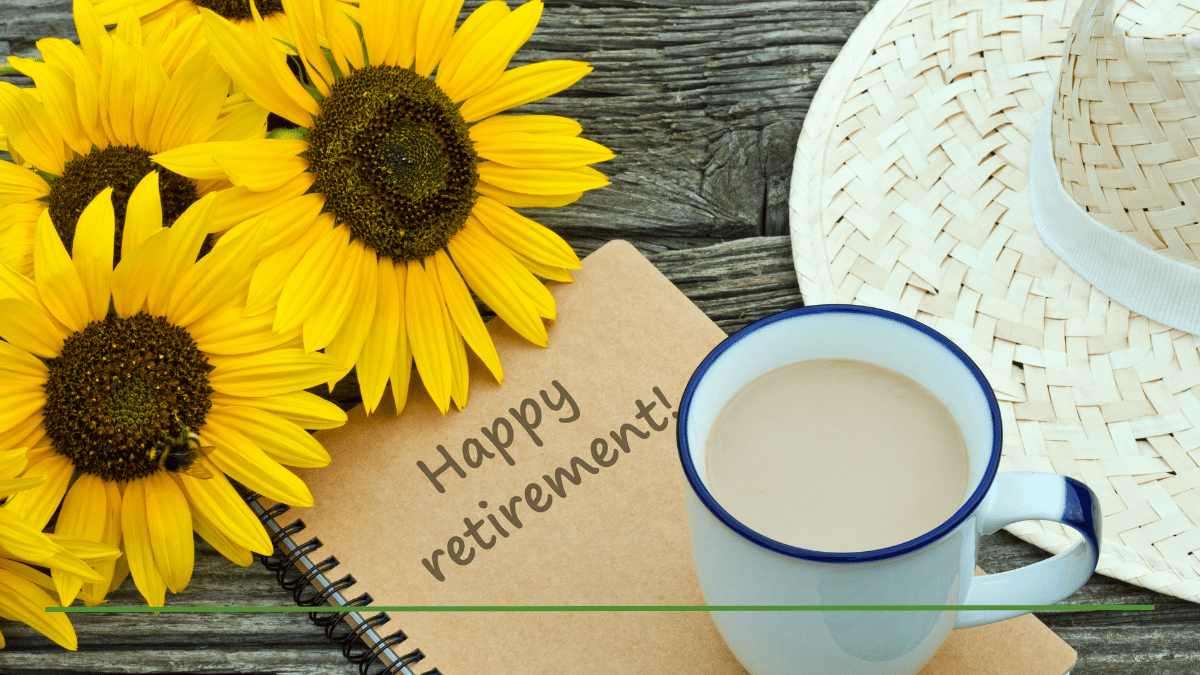 Sunflowers, a coffee mug, and a notebook reading 'Happy retirement!' — illustrating the question, is a Roth IRA good for retirement