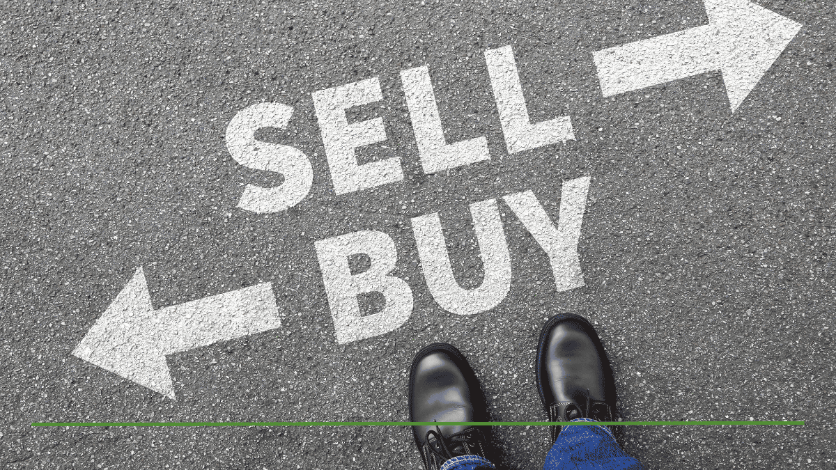 Person standing between painted SELL and BUY arrows on pavement, representing how to rebalance your portfolio without selling