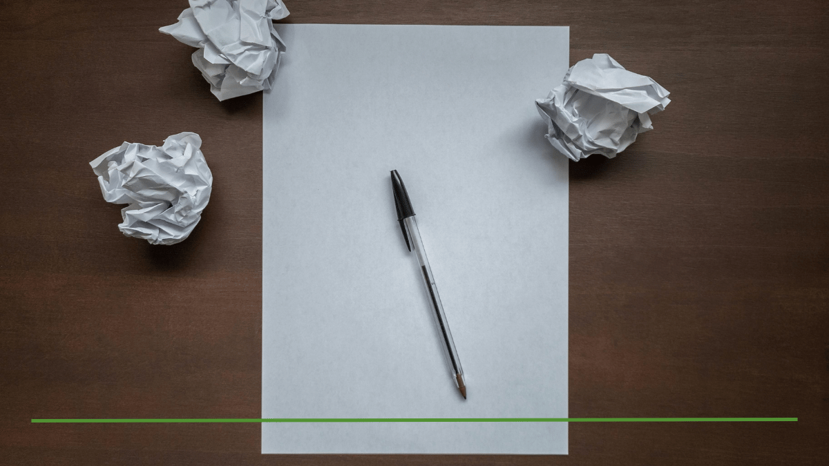 Blank sheet of paper with a pen and crumpled drafts on a desk, representing the biggest Roth conversion mistake: no plan