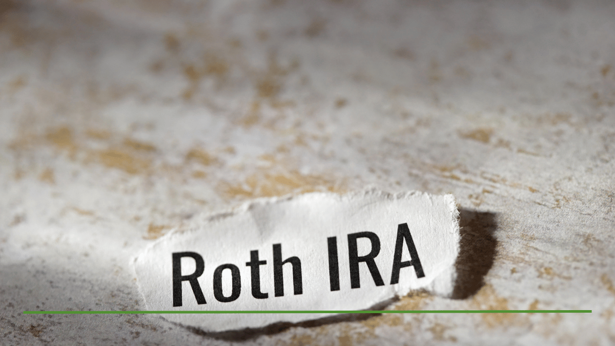 Torn paper scrap labeled "Roth IRA" on a textured surface, illustrating the sweet spot for Roth conversions