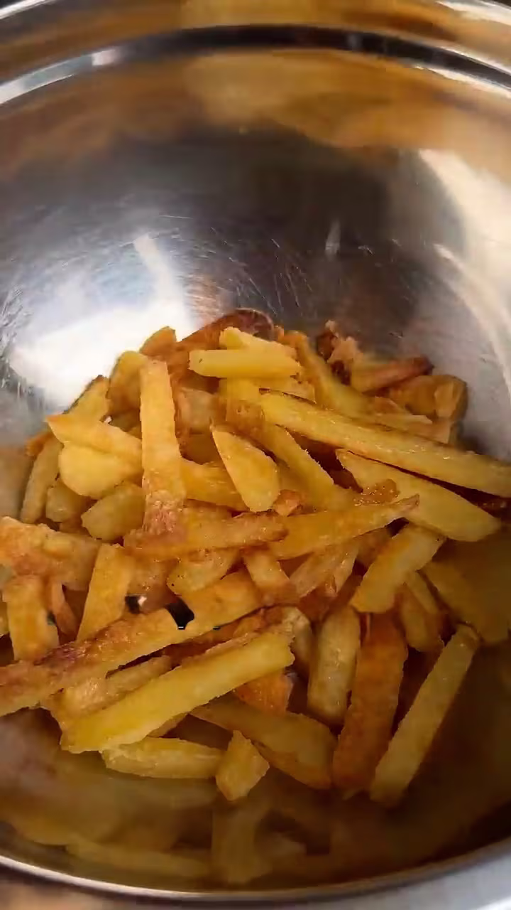 resultado de la doble cocción con bicarbonato, papas crocantes y doradas