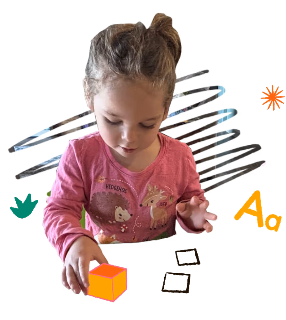A little girl playing with blocks