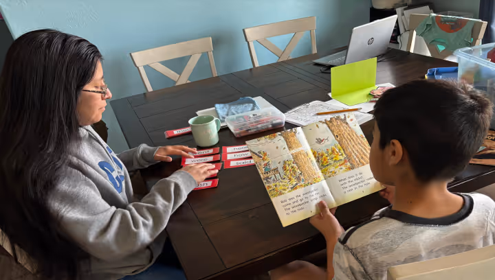 Teacher turoring a preschool student