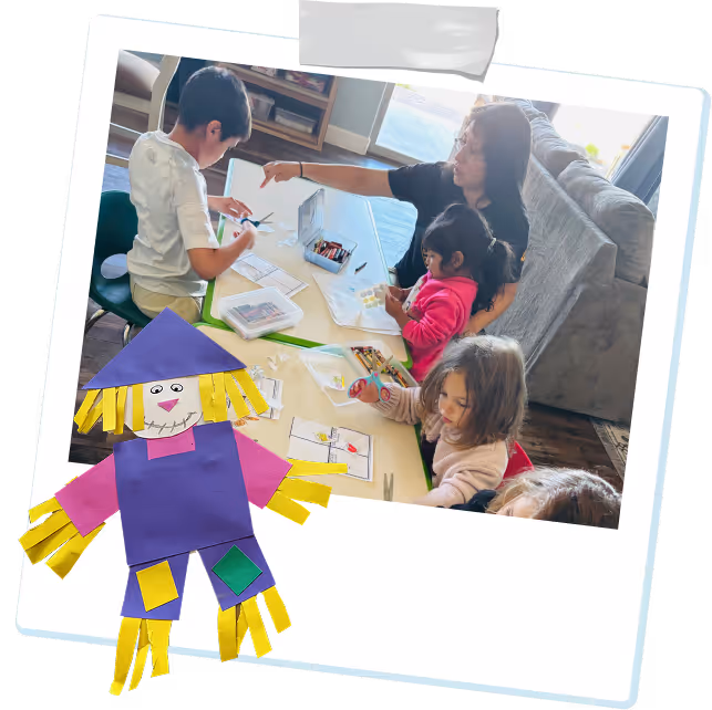 A teacher teaching how to cut shapes