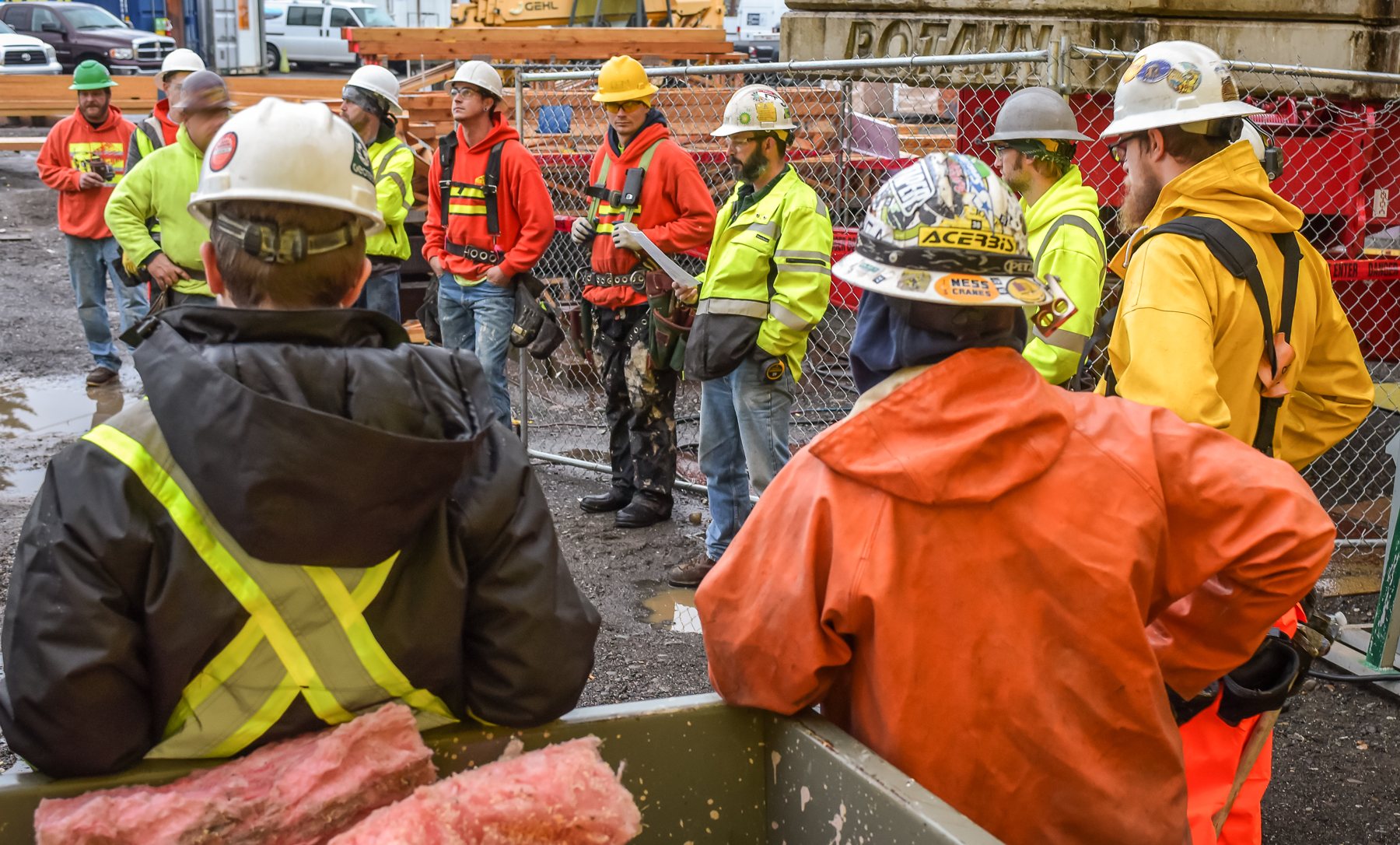 Dawson crew safety huddle on an active jobsite