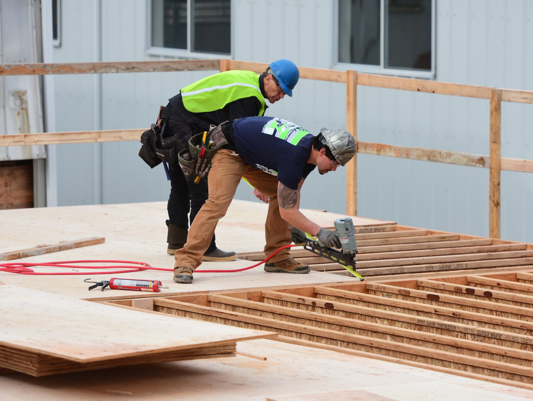 Dawson carpenter making a precision cut on a jobsite