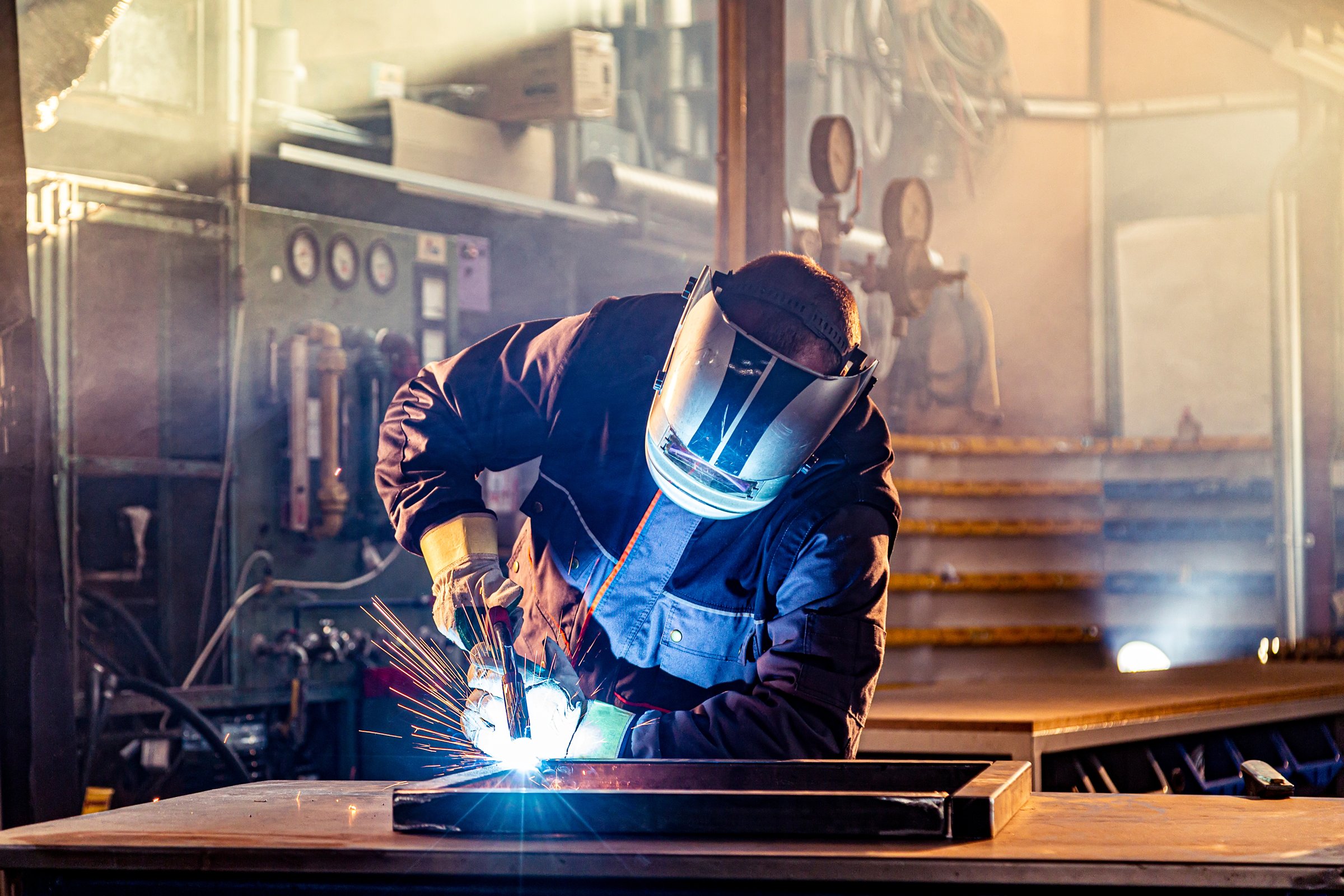 Dawson craftworker welding steel in the in-house fabrication shop