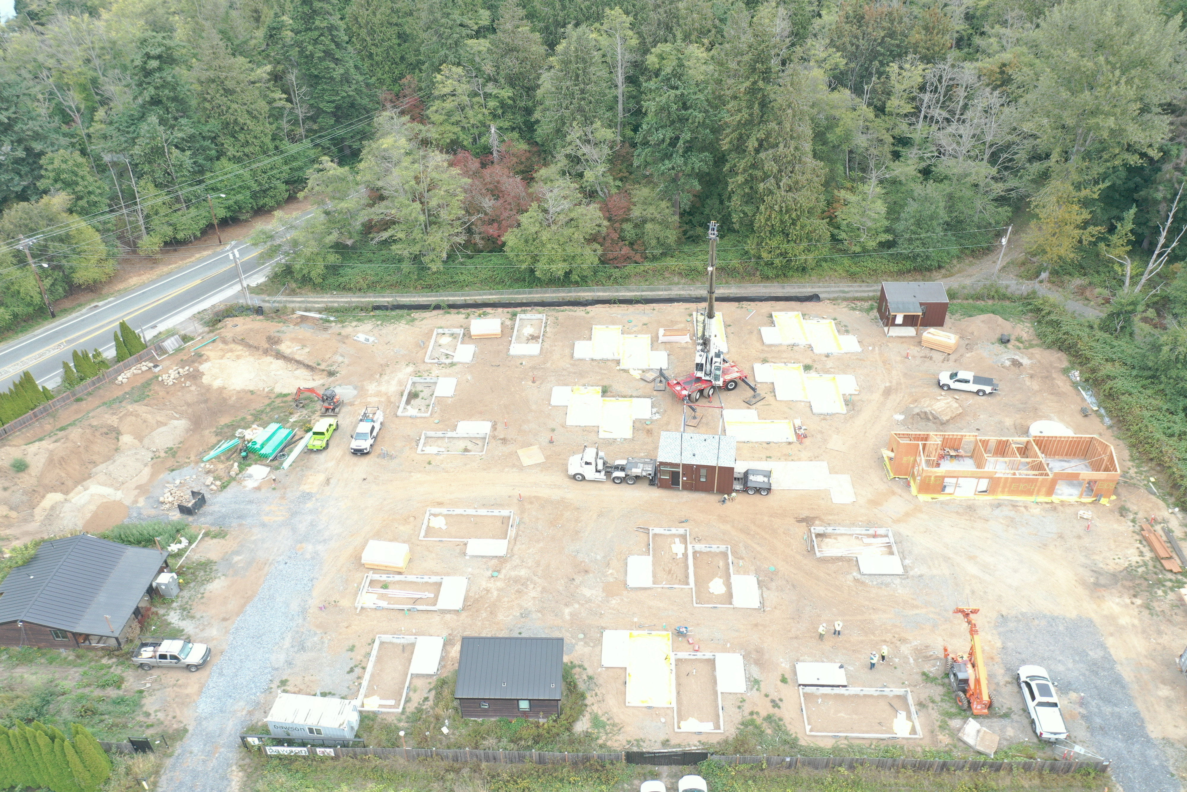 Aerial view of the site with insulated foundation pads poured and waiting in rows