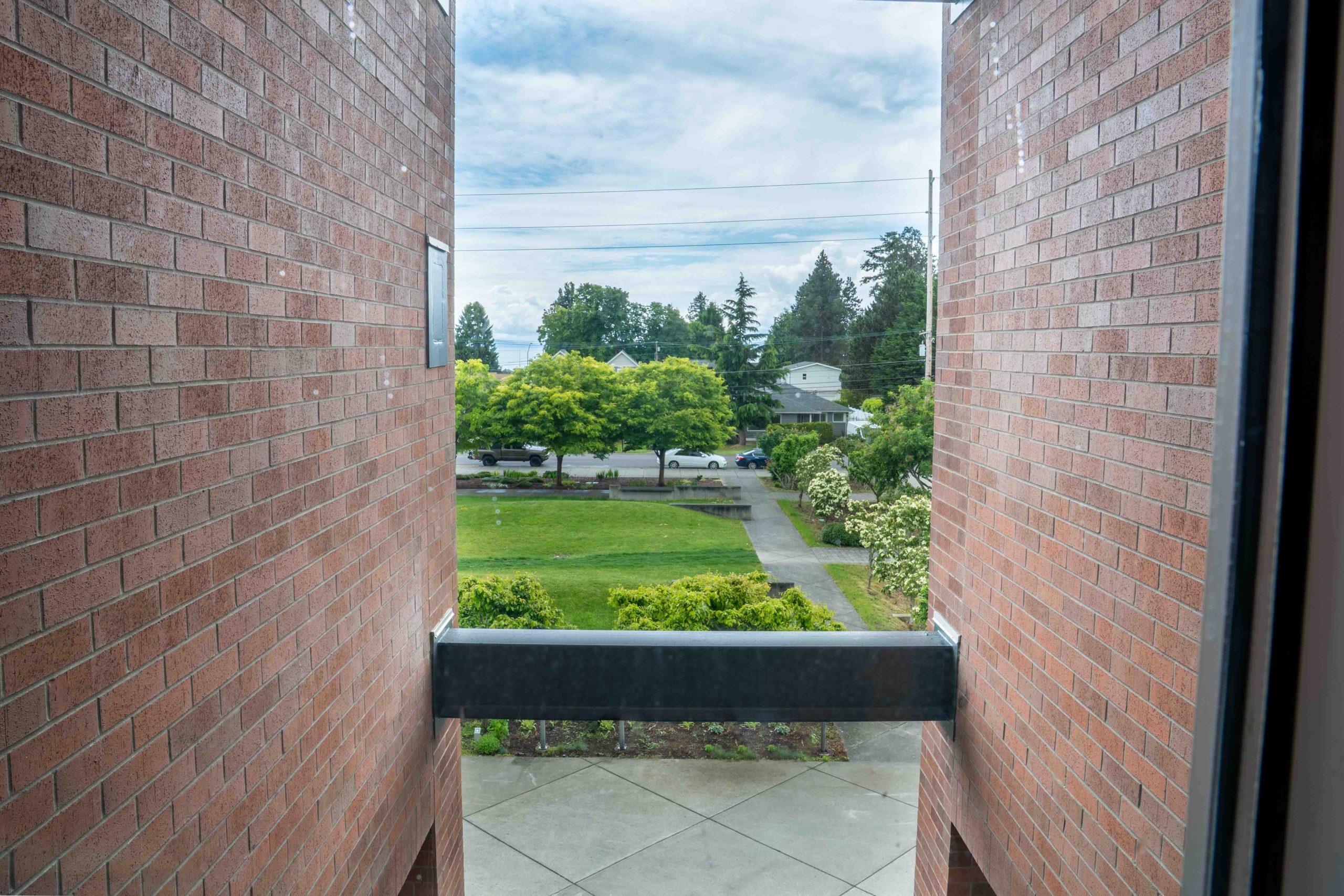 View through Campus Center brick window opening at Bellingham Technical College