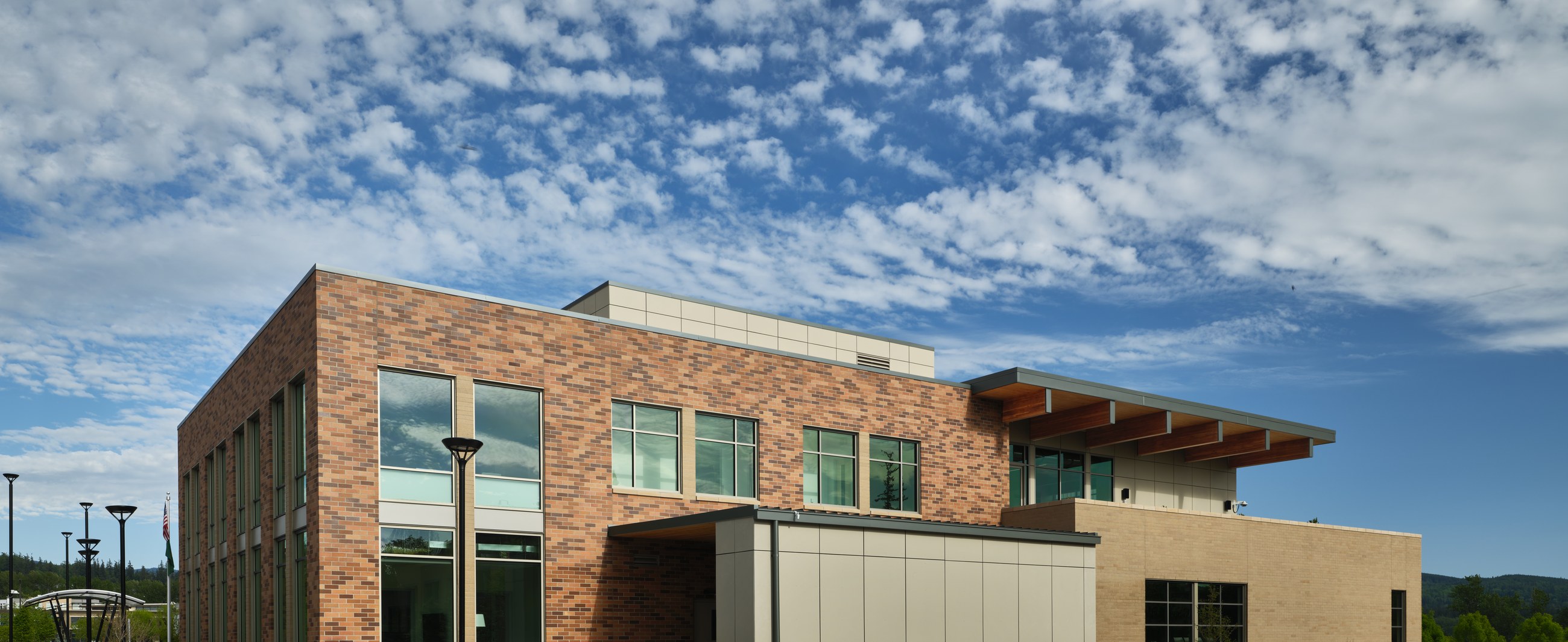 District Office Building corner elevation showing brick and timber detailing