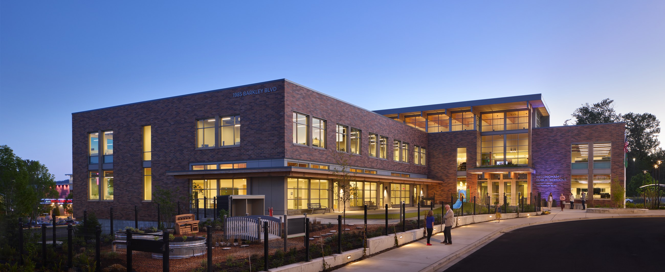 Bellingham School District Office Building exterior at dusk with warm interior lighting