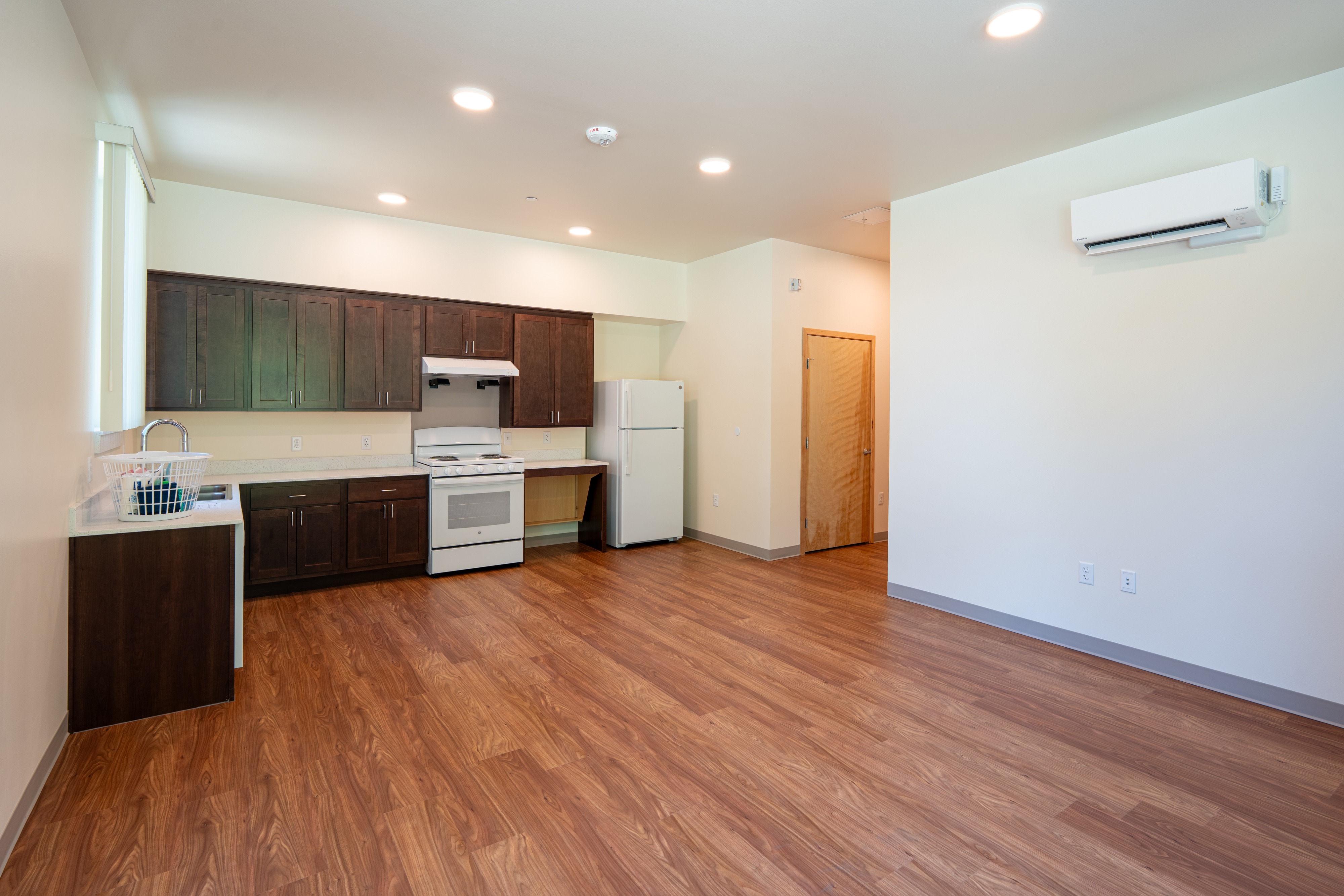 Apartment kitchen and living space at Bellis Fair Family Housing