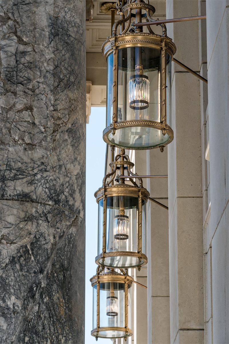 Restored bronze lanterns and Tokeen marble columns at the Alaska State Capitol portico