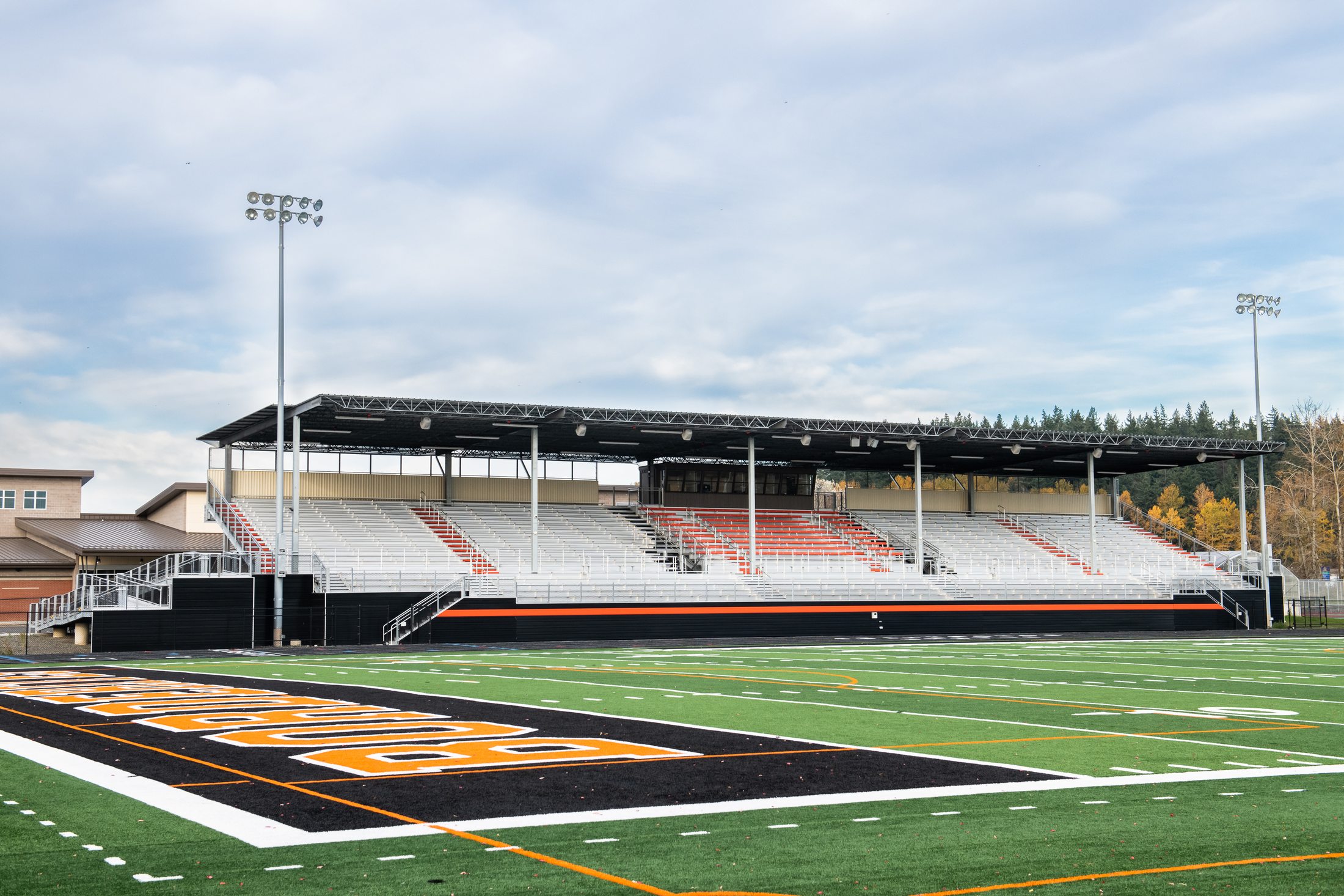 New Blaine High School grandstands from midfield with covered seating in Borderites orange
