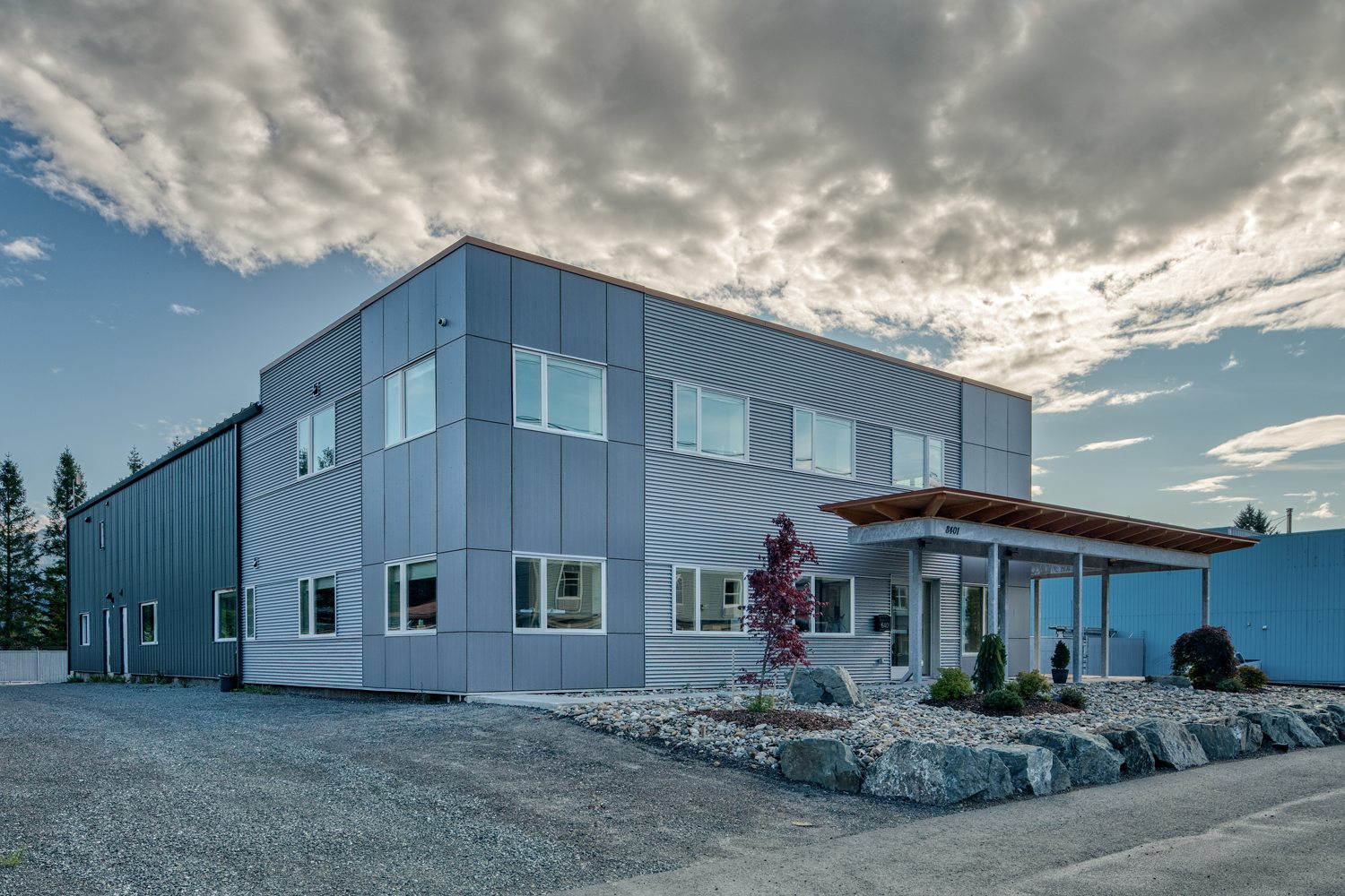 Dawson Alaska Headquarters office and attached shop seen from the working yard under a dramatic Juneau sky
