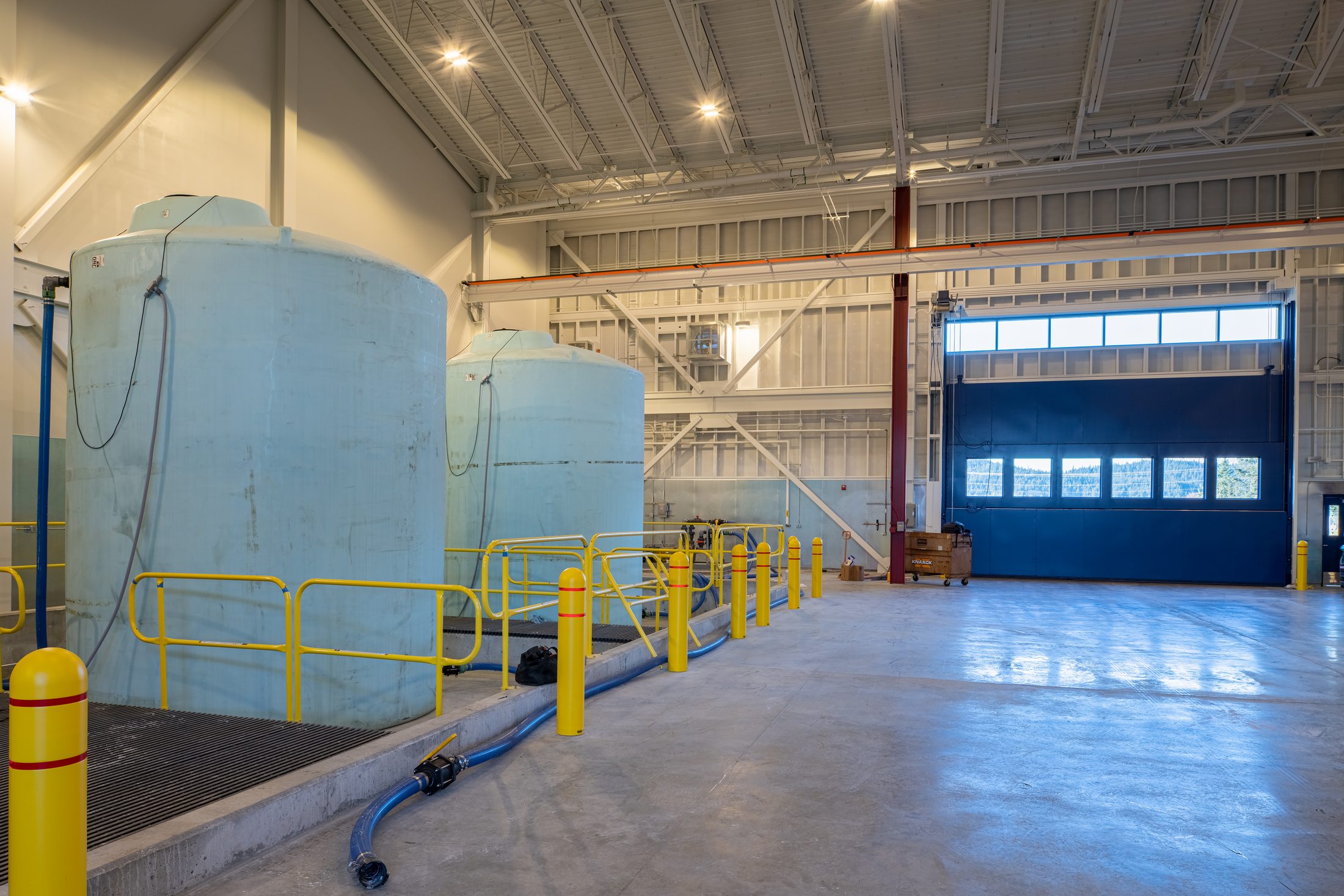 Deicing chemical tanks with safety railings inside the Juneau airport sand and chemical building