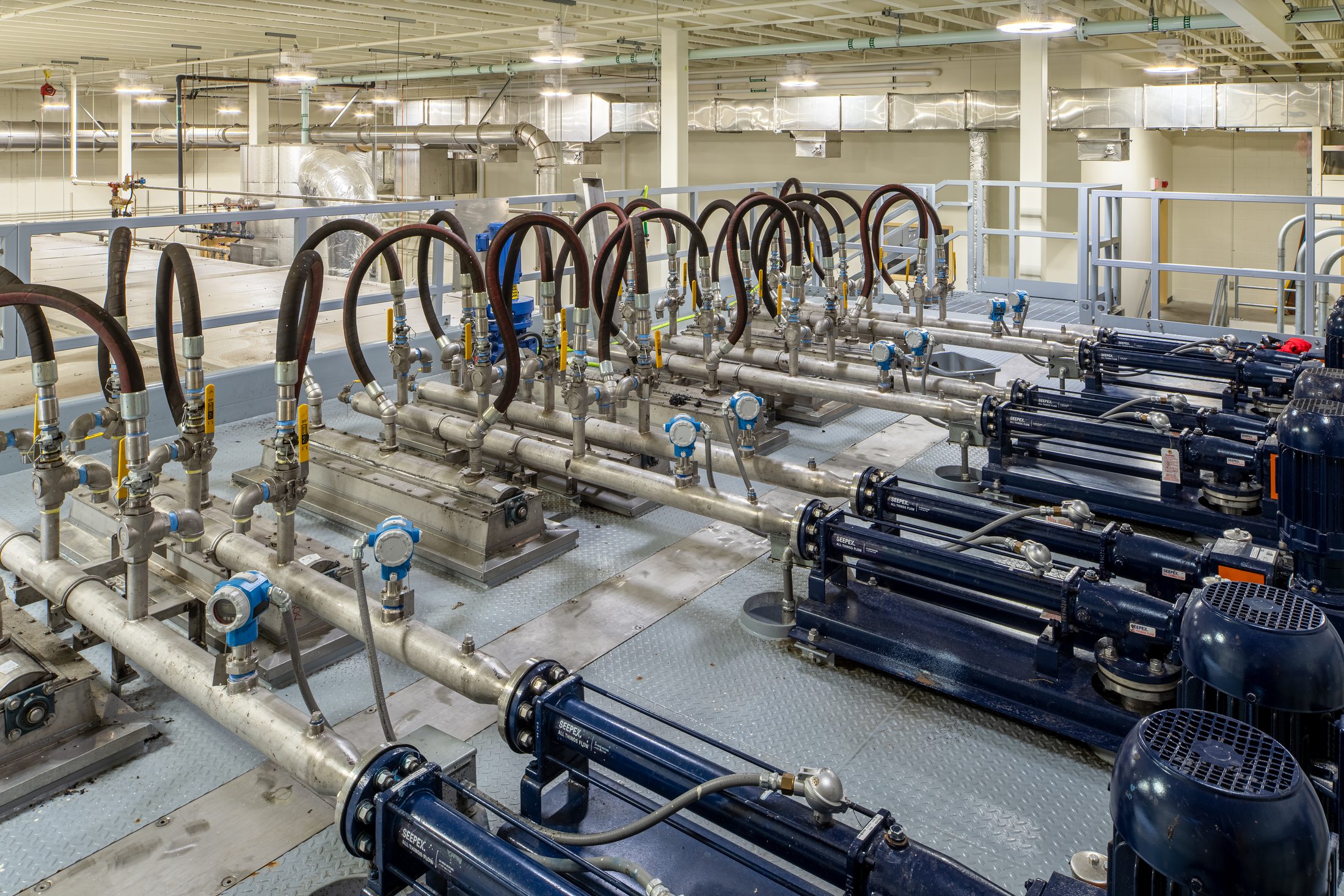 Progressive cavity pump gallery feeding the biosolids dryer at Juneau's Mendenhall Valley treatment plant