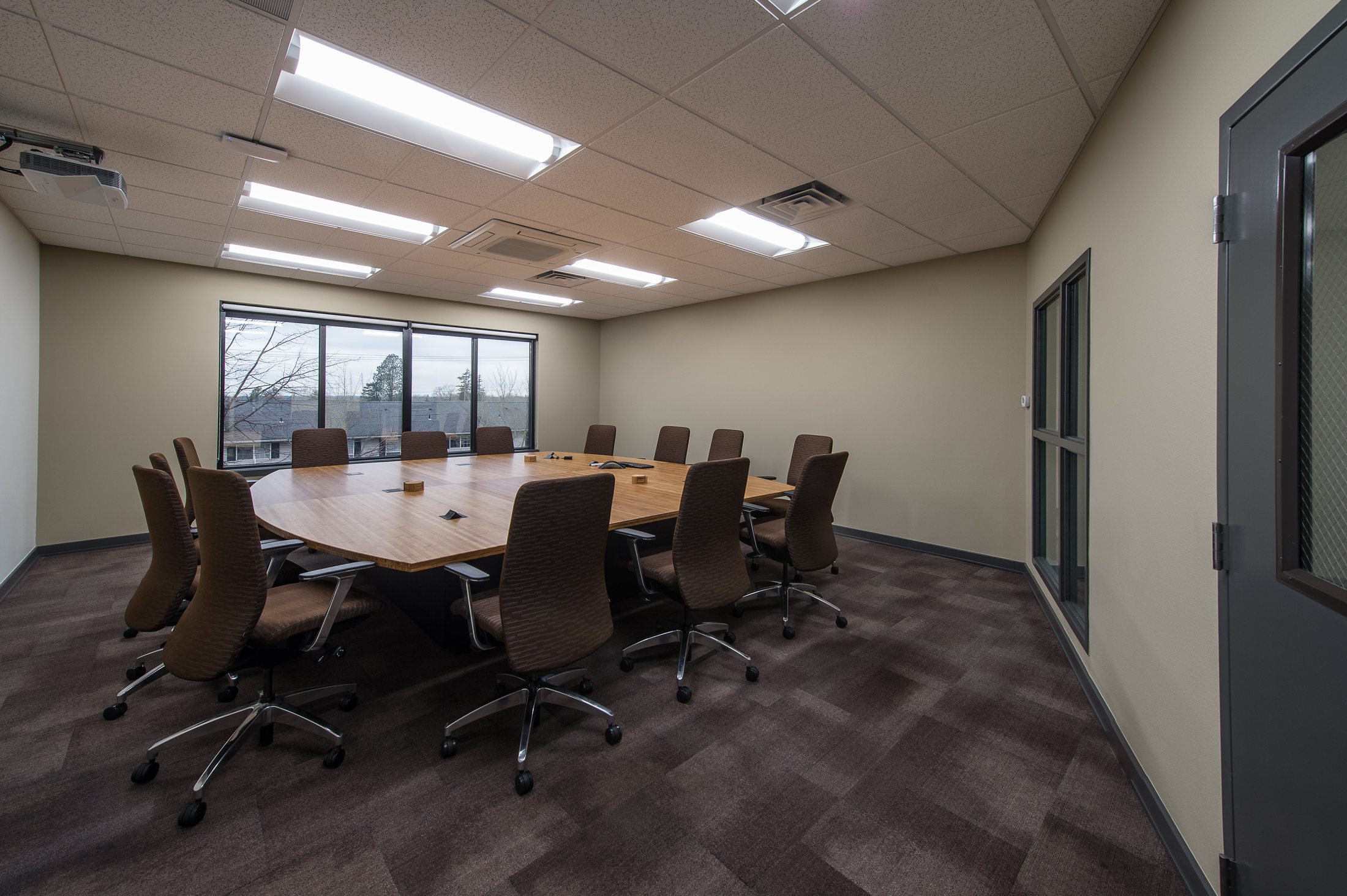 Conference room with bamboo table at WECU's Barkley District branch, Bellingham