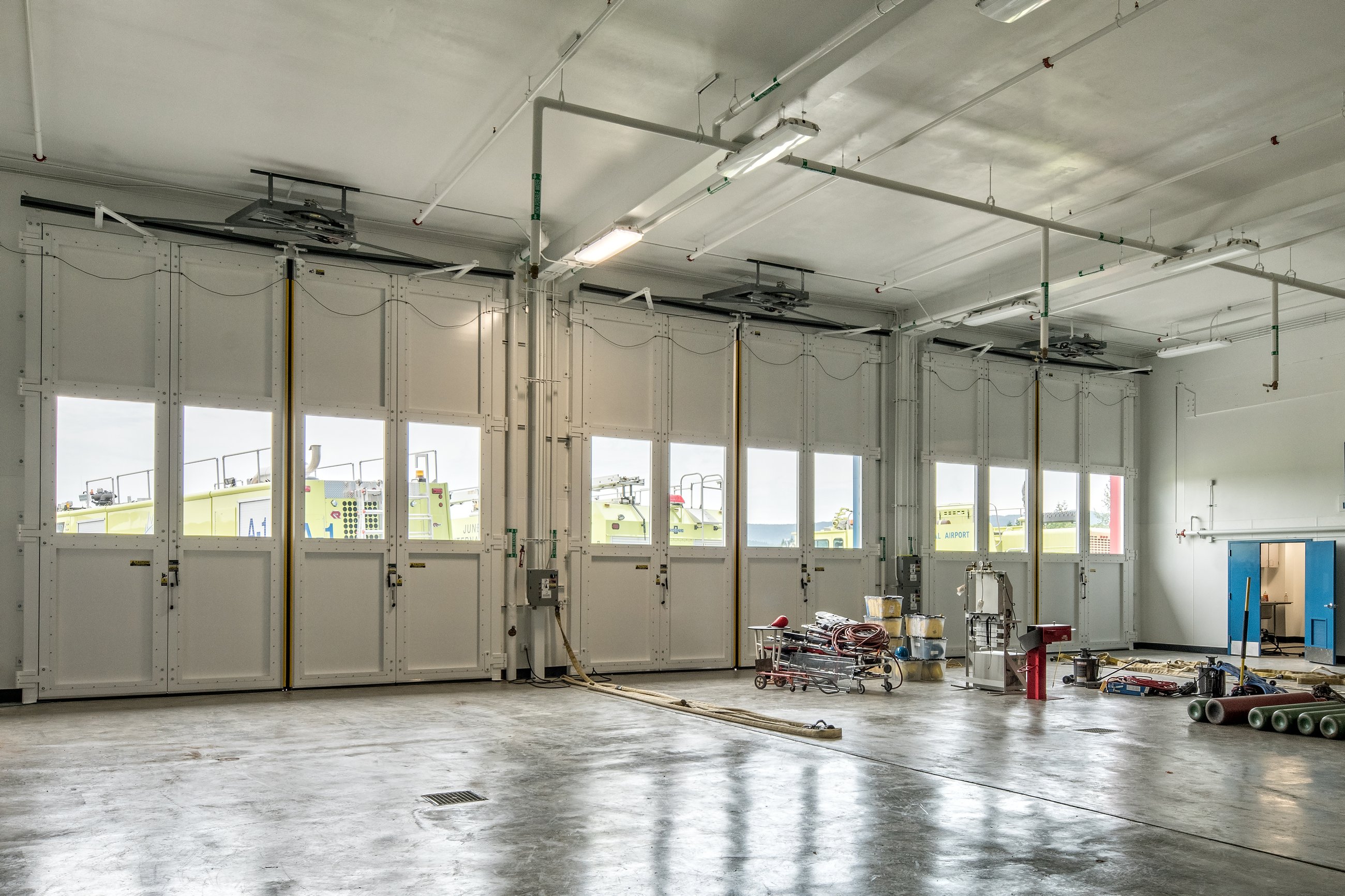 Apparatus bay interior with vehicle doors at the Juneau Aircraft Rescue and Firefighting Station