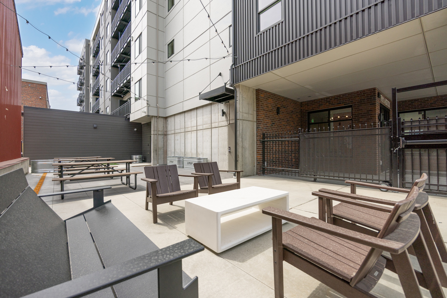 Courtyard lounge seating below the Block 6 building