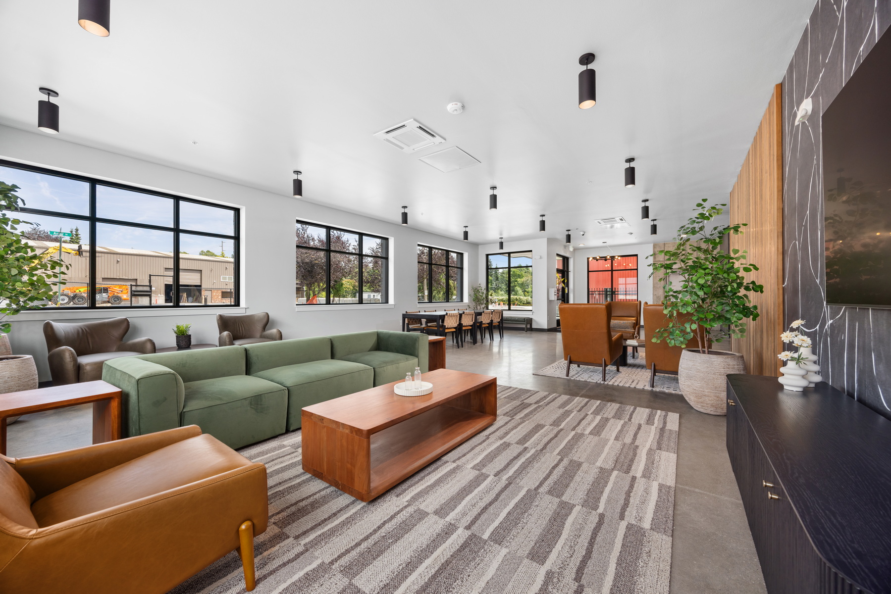 Ground-floor lounge with street-facing windows at Block 6