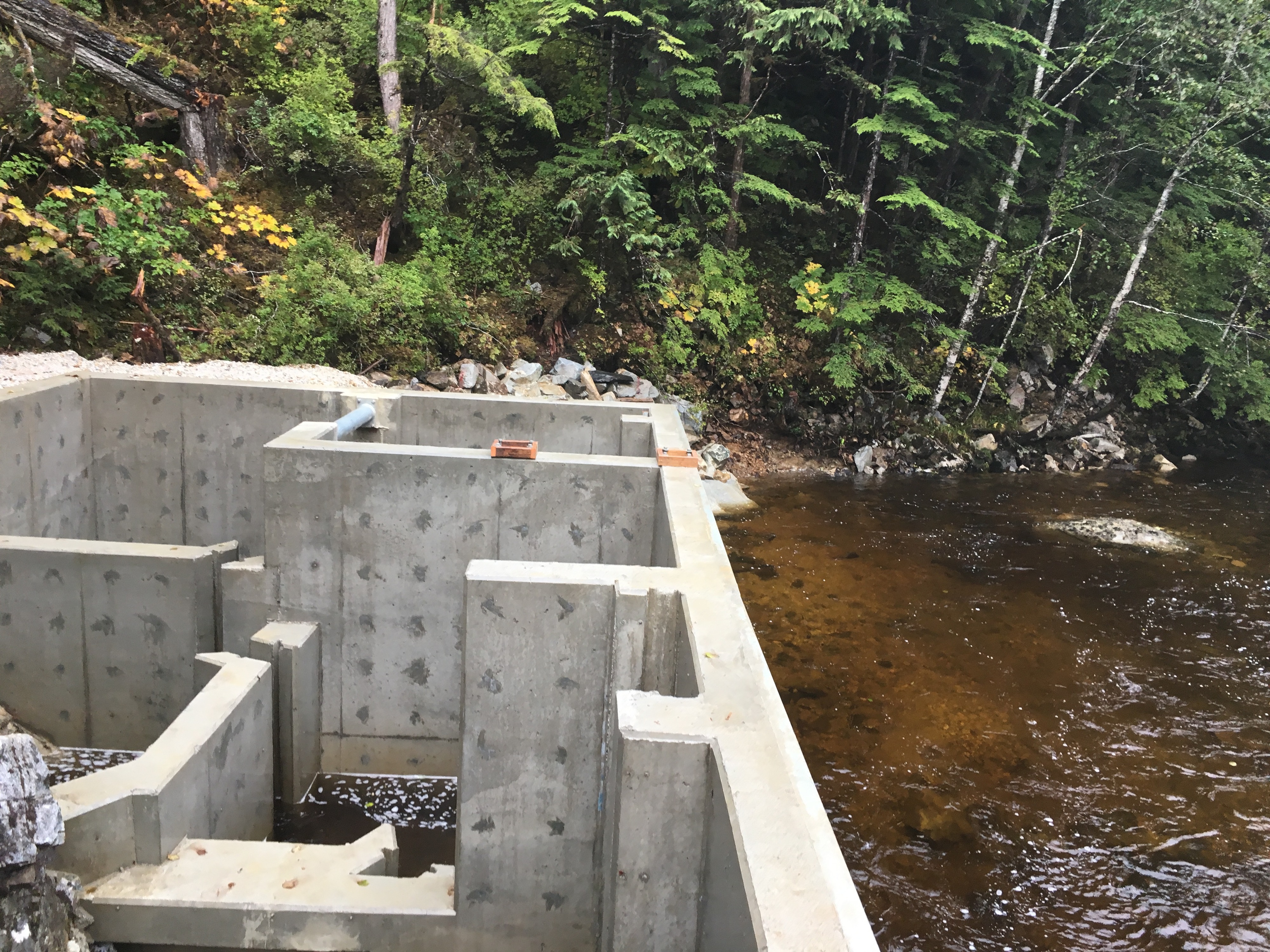 Indian River Hydroelectric Phase 3 concrete walls at the water
