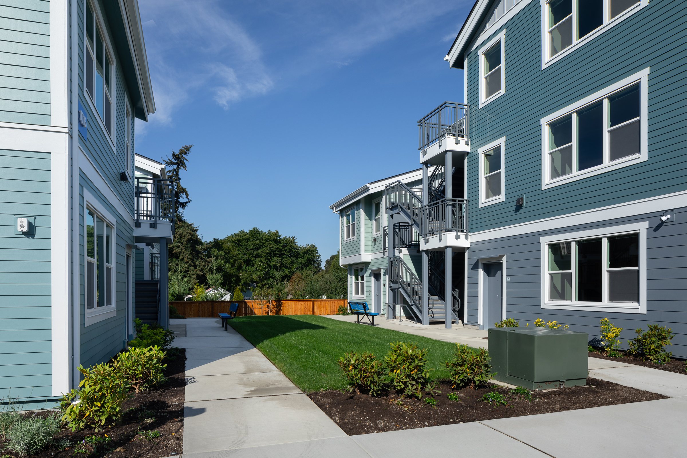 Courtyard lawn and walkway between apartment buildings at Ballington Flats