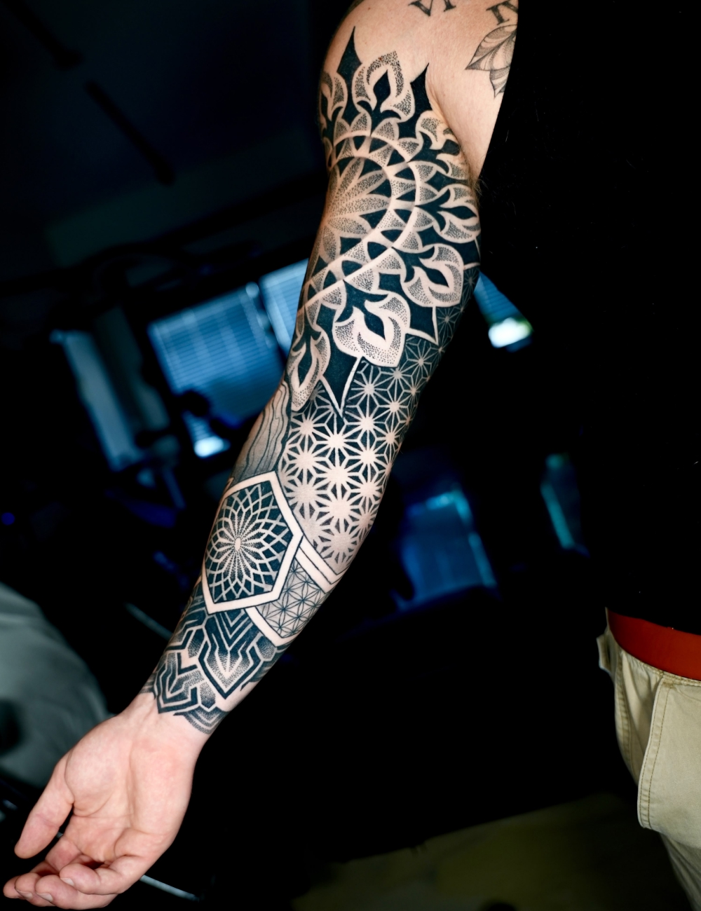 Sacred geometry sleeve tattoo with dotwork hexagons and mandala details by Juanky