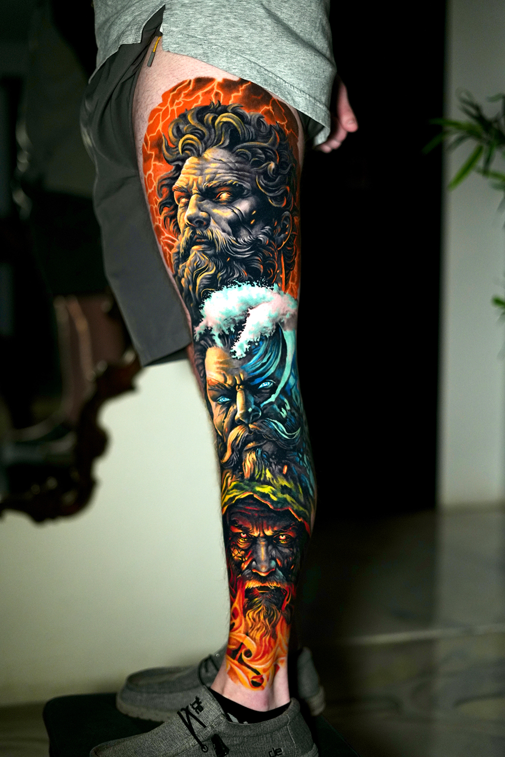 Color realism leg sleeve tattoo of the Greek gods Zeus, Poseidon and Hades at The Secret Tattoo Studio in Tampa