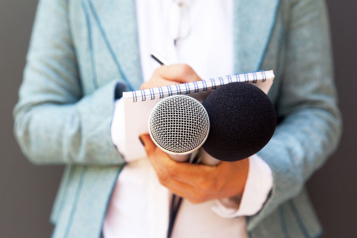 A reporter conducting a media interview