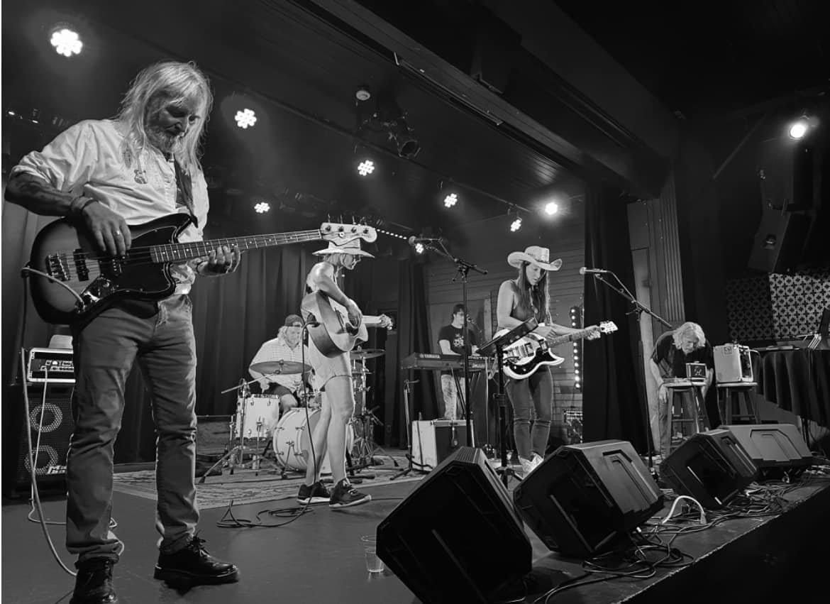 The band on stage at Wiseman Hall