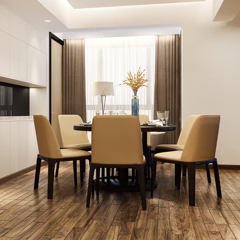 Modern dining room with round dark wood table, six beige upholstered chairs, a blue vase with yellow flowers, and a floor lamp by a curtained window.