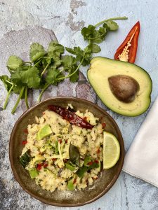  Avolution Avocado Delight - Creamy avocado and carrot upma served in a bowl, garnished with coriander and ginger julienne.