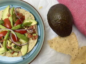 Gourmet Avocado Masala Papad: Thin and crispy papad complemented with a rich mixture of avocado, aromatic spices, and a hint of lime.