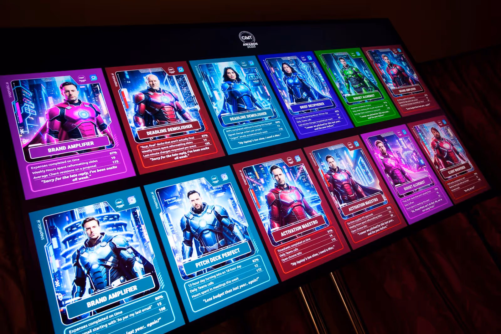 Digital display wall of AI-generated trading cards at a Las Vegas corporate event, showcasing a variety of custom superhero-style character portraits.