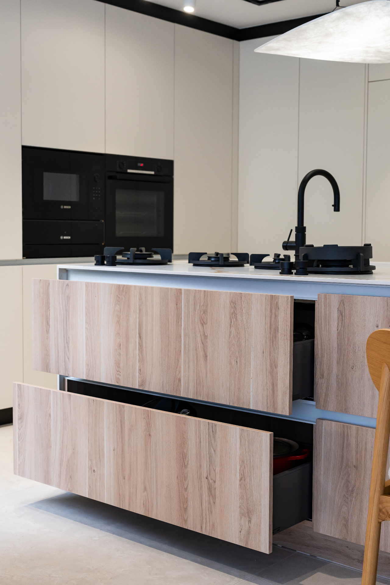 Detail of shadow-gap reveal between oak cabinet doors