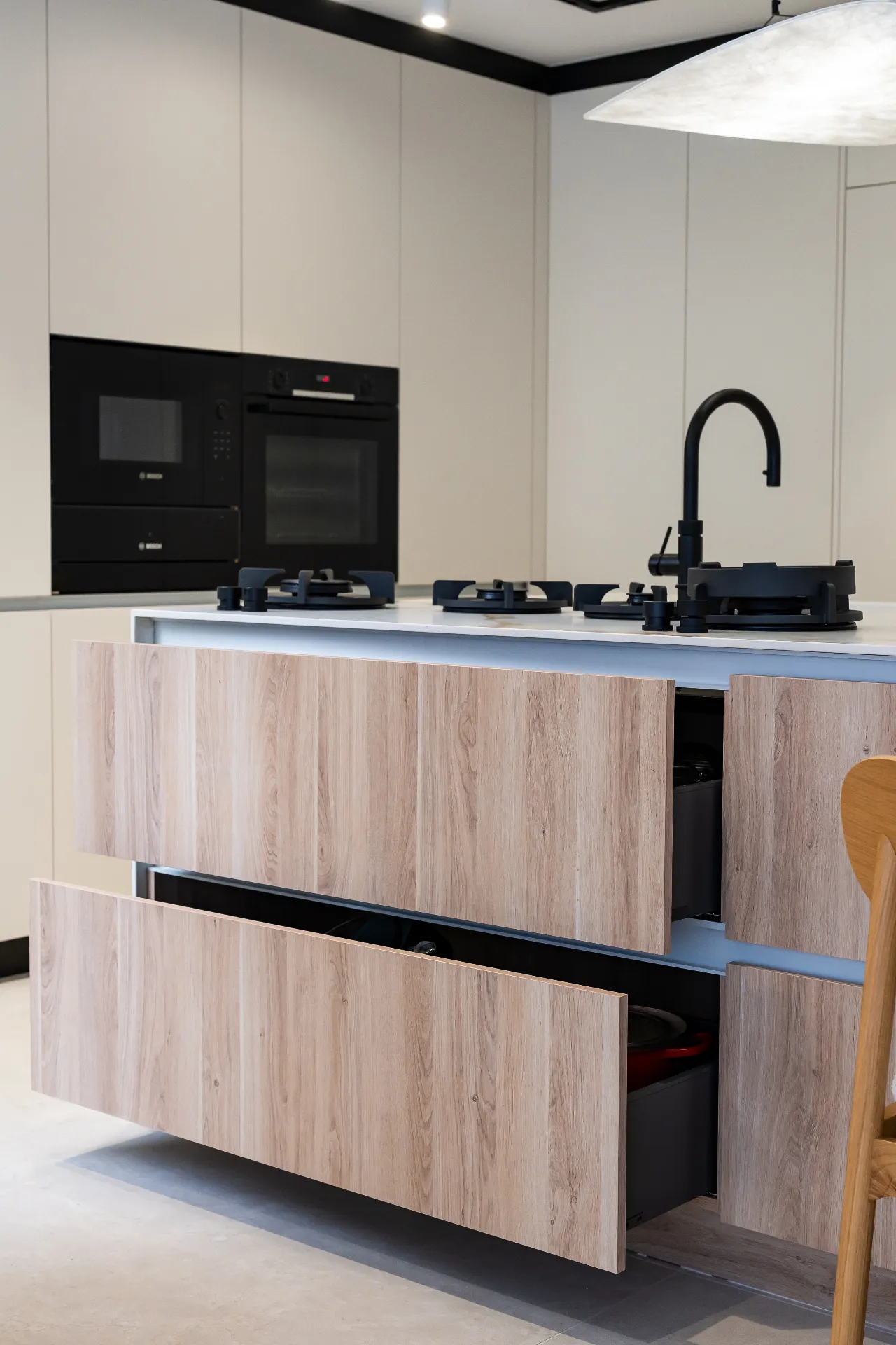 Detail of shadow-gap reveal between oak cabinet doors