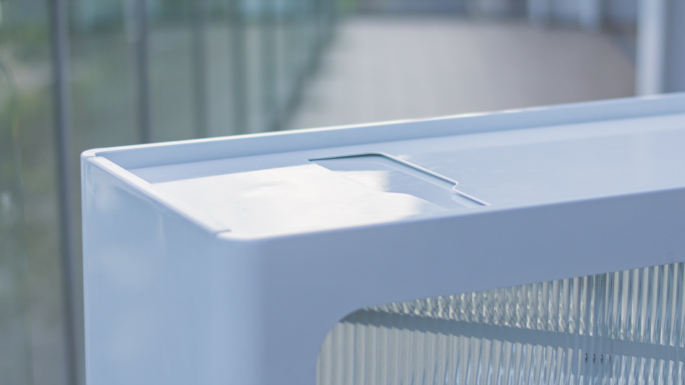 Detail of the bin's rounded top edge and bottle slot