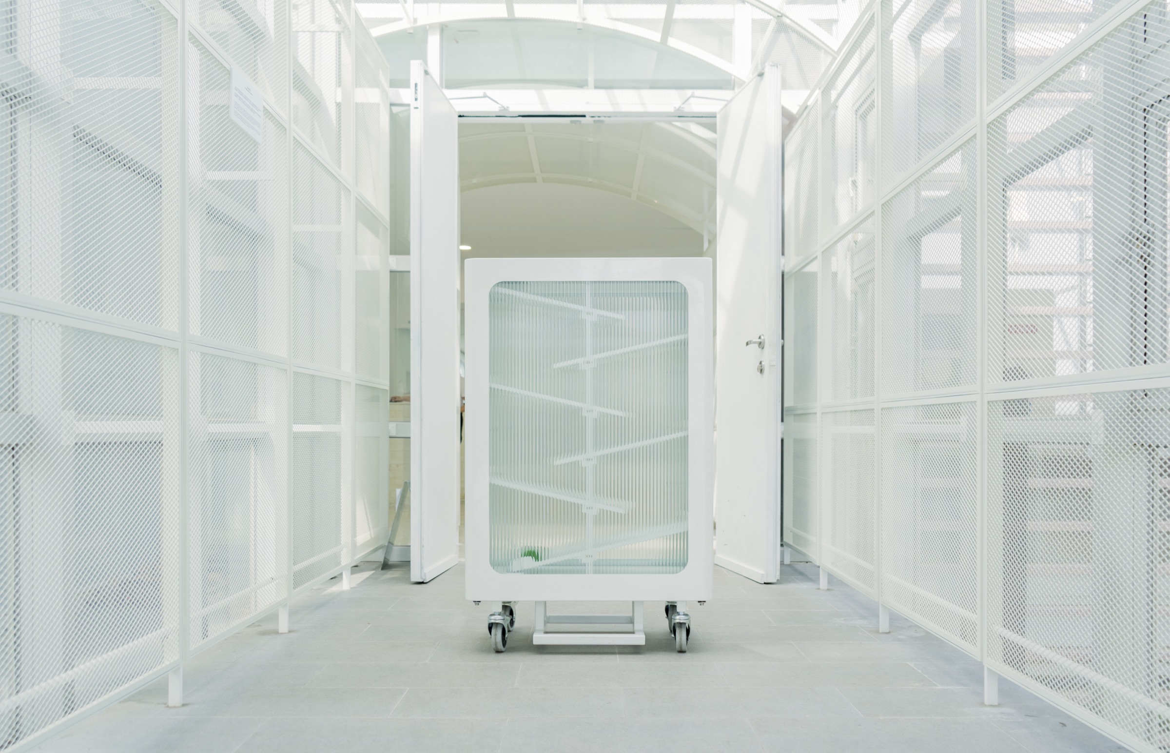 The recycling bin installed inside a light-filled corridor