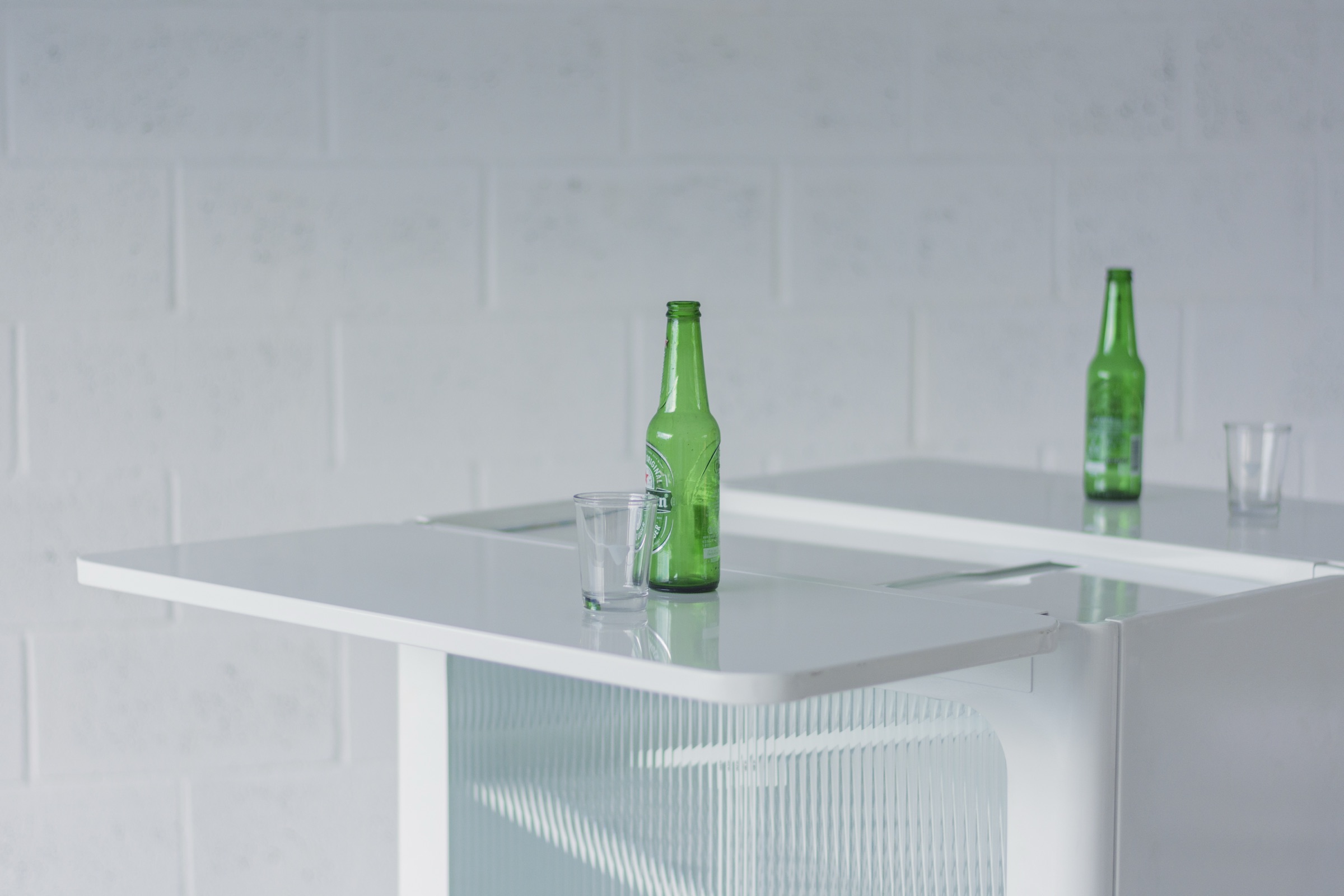 Bottles and glasses on the fluted-glass bar table
