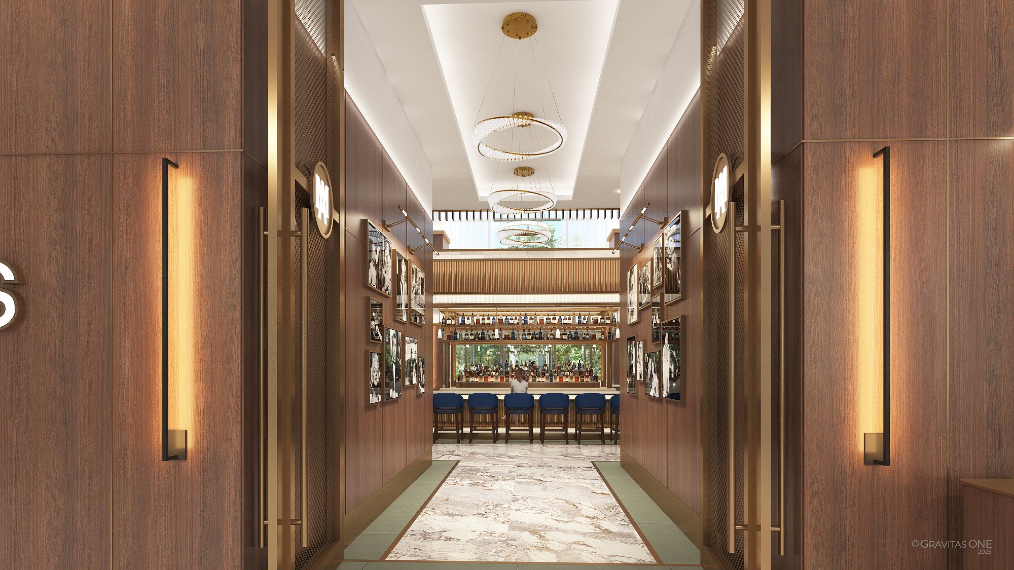 Modern hallway with wood-paneled walls leading to a bar area with blue stools and hanging circular chandeliers.