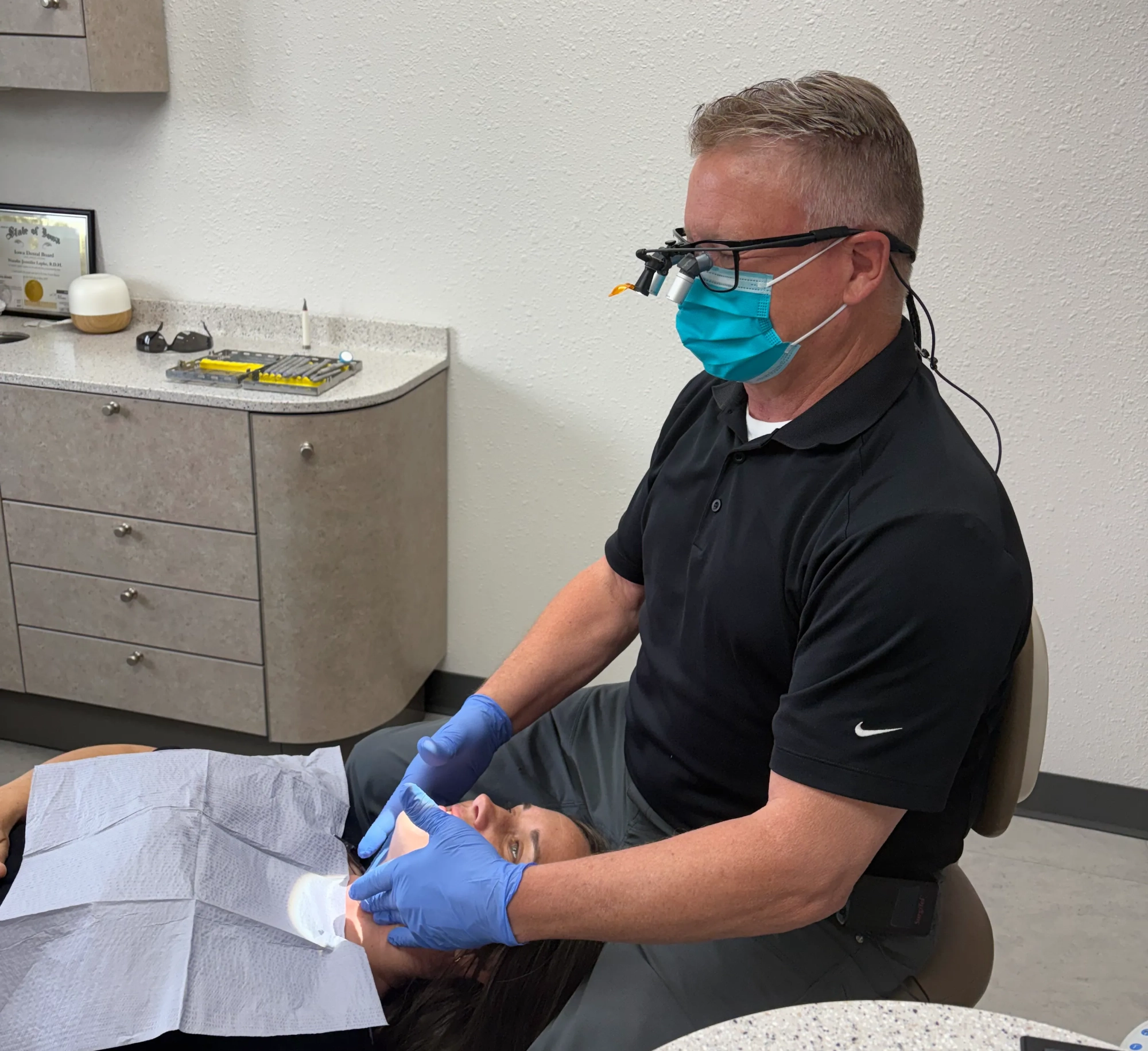 Treatment room at Markham Family Dental with a dental chair, X-ray unit and window